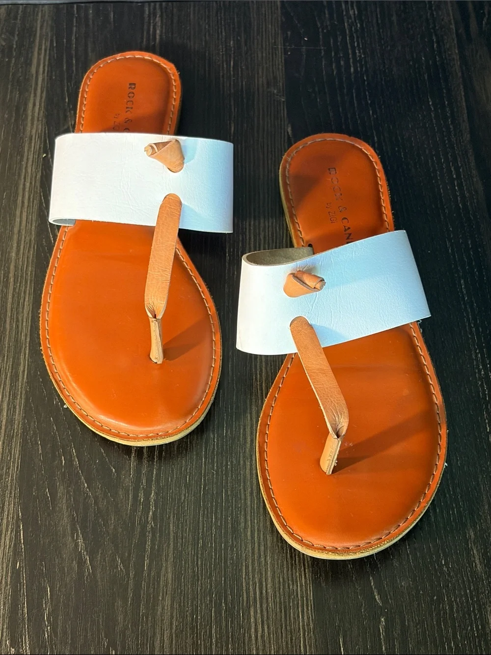 Rock & Candy White Strap Orange Footbed Toe-Post Sandals